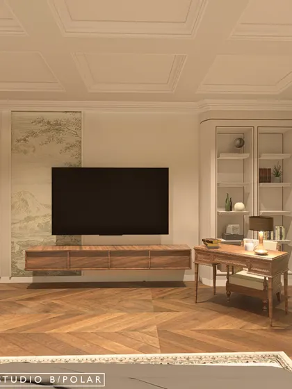 The TV is mounted on a simple wall, flanked by a wallpaper panel and the study nook. The herringbone wooden floor adds warmth and a timeless pattern to the space.