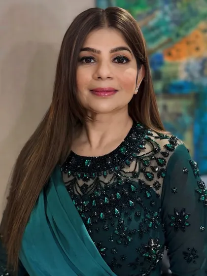 A portrait of the client, looking poised and beautiful with her professionally styled hair and makeup.