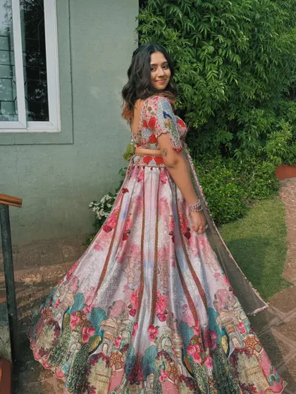 A fun, twirling shot that shows off her beautiful floral lehenga.