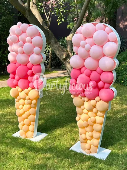 What's cooler than ice cream? Two giant ice cream cone sculptures made from balloons, adding a huge wow-factor to this outdoor party.
