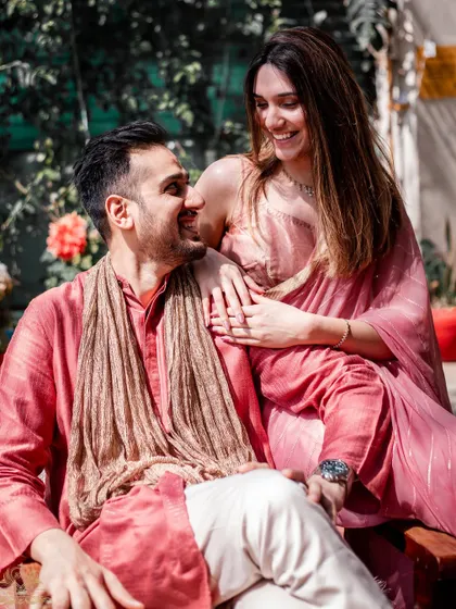 A sun-kissed moment of affection during a pre-wedding shoot. The natural light and genuine smiles make this a timeless portrait of love.