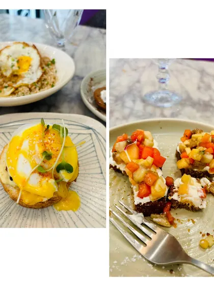 A delectable brunch plate featuring classic Eggs Benedict and a sweet fruit bruschetta. The perfect balance of savory and sweet.
