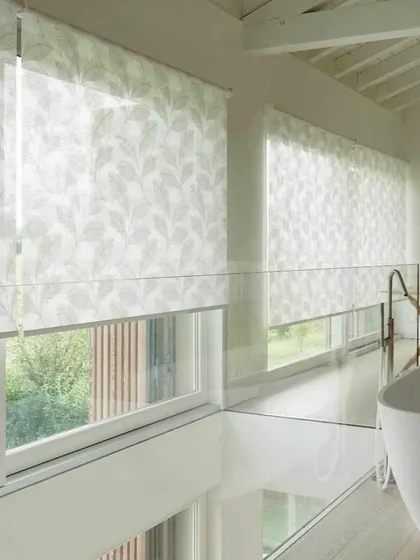These light-filtering roller blinds feature a delicate leaf pattern, adding a touch of nature to the bathroom. They provide privacy while allowing soft, diffused light to enter.