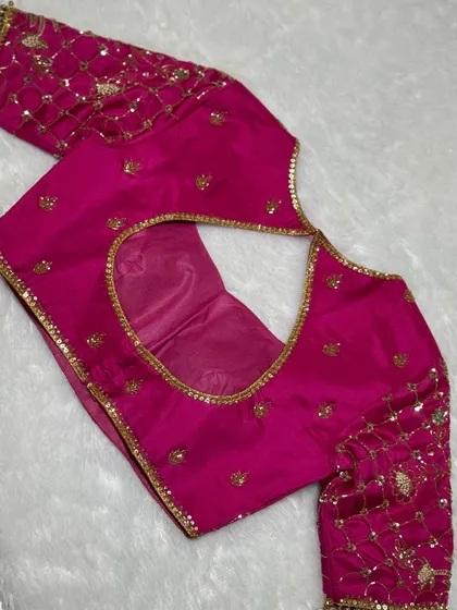 Not just a blouse, this is bling with a backbone. Drenched in rich color and layered with legacy stitches.