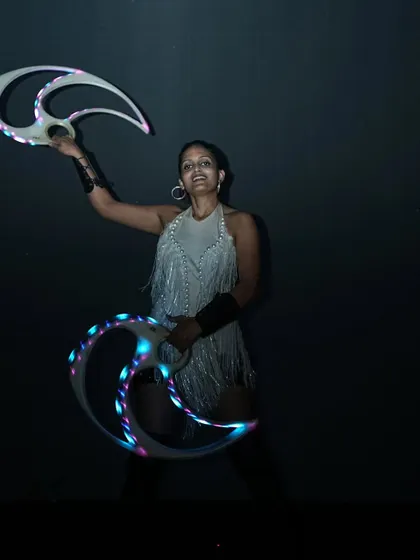 A shot from a performance in the dark, where the LED fans are the only source of light. The patterns they create are absolutely mesmerizing.