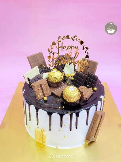 You can never have too much chocolate. My Chocolate Overload cake is pure indulgence, featuring a rich drip, and topped with an assortment of chocolates like Ferrero Rocher, KitKat, and Dairy Milk.