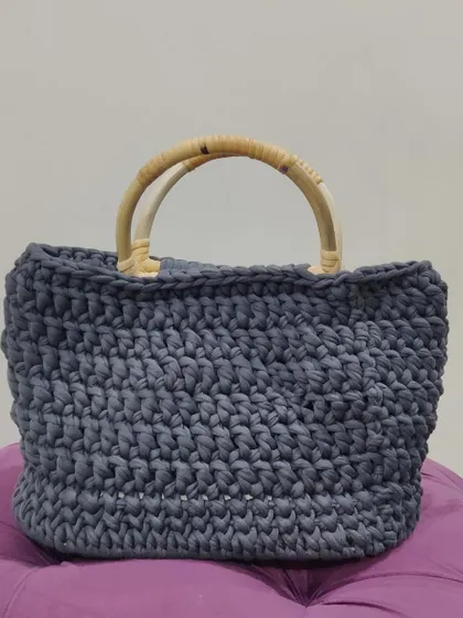 This grey T-shirt yarn bag is so versatile. It's strong enough for groceries but stylish enough for a day out.