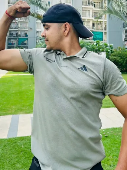 Close-up bicep flex outdoors.