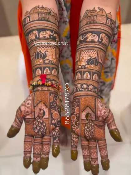 This design features peacocks on the palms and elephants on the forearms, two of the most popular motifs in traditional bridal mehndi.
