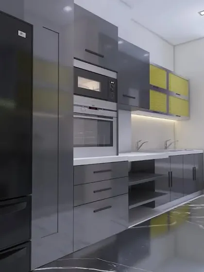 A modern kitchen with high-gloss grey cabinets, built-in appliances, and a black marble countertop.