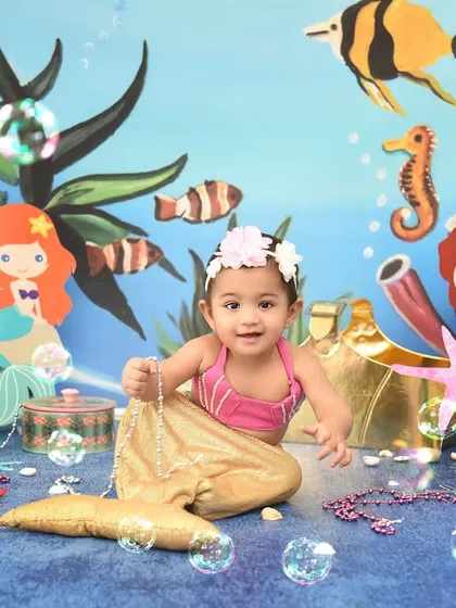 A magical mermaid adventure under the sea. This theme is complete with a mermaid tail, bubbles, and colorful sea creatures for an enchanting experience.