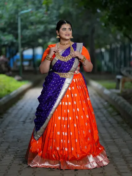 A full view of the custom orange and blue half saree, designed to shine bright for Navaratri.