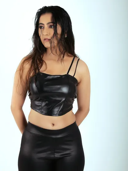 Another shot from the same series, showing a different pose. The simple setup allows the model's confidence to shine through.