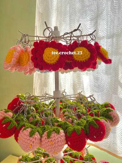 My flower and strawberry keychains are some of my bestsellers. This image highlights the detailed stitching and bright colors that make them stand out.