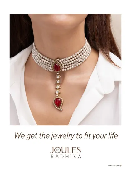 A delicate pearl choker with a ruby and polki pendant, illustrating how we get jewelry to fit your life and style.