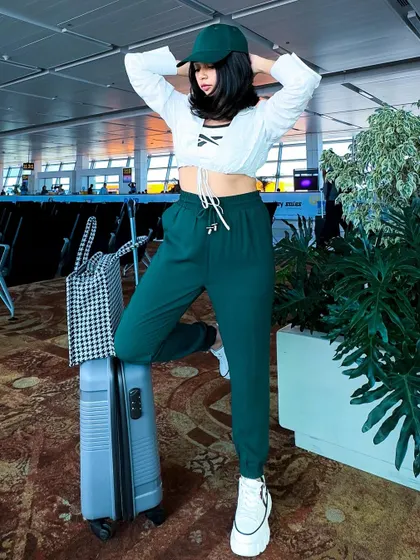 A confident pose, feeling ready for my flight. A good travel outfit should be both practical and make you feel good.