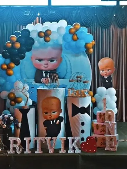 We can create a full Boss Baby experience, as seen in this setup for Ritvik's birthday. The stage is filled with characters, themed props, and coordinated balloons for a party that's all business.
