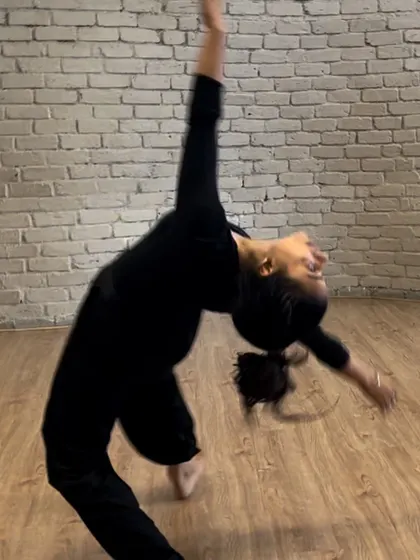 A dancer captured mid-flow, demonstrating the expressive backbends and fluidity we teach in our contemporary classes, even for beginners.