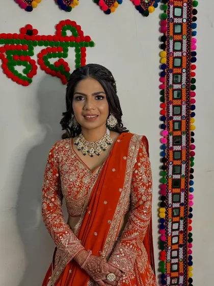 A happy and confident bride. The makeup is kept elegant and fresh, allowing the intricate outfit and jewellery to shine.