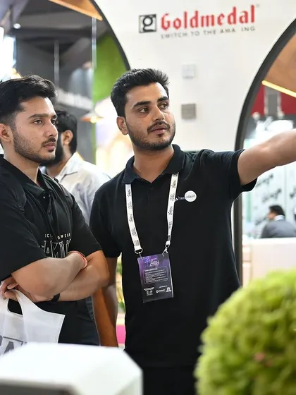 A team member guiding visitors through the exhibition hall. We are always happy to connect and share our passion for technology and design.