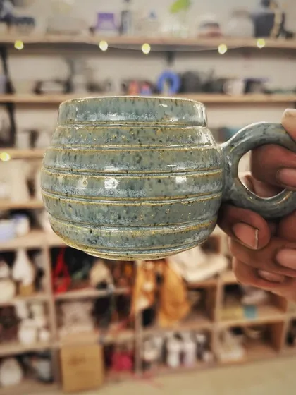 This student created a wonderful variety of forms and textures in her beginner's course, from a marbled Nerikomi bowl to a textured mug with a unique handle.