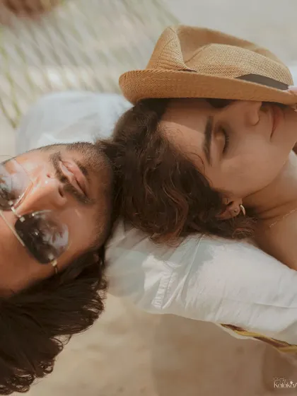 A relaxed moment in a hammock on the beach. This shot perfectly captures the laid-back, vacation vibe of a destination pre-wedding shoot.