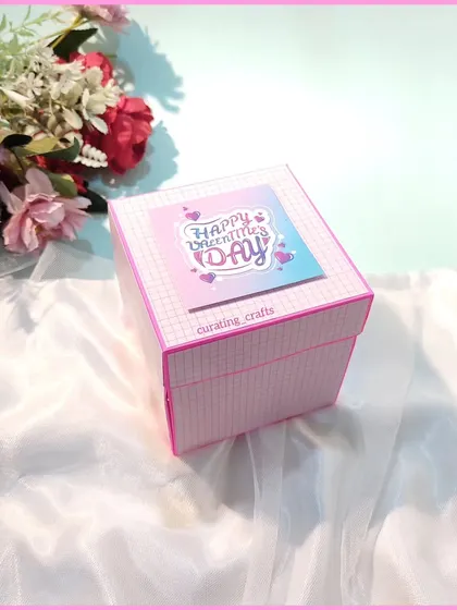 A closed view of the Valentine's Day explosion box. The simple and elegant exterior hides the intricate and heartfelt surprise waiting inside.