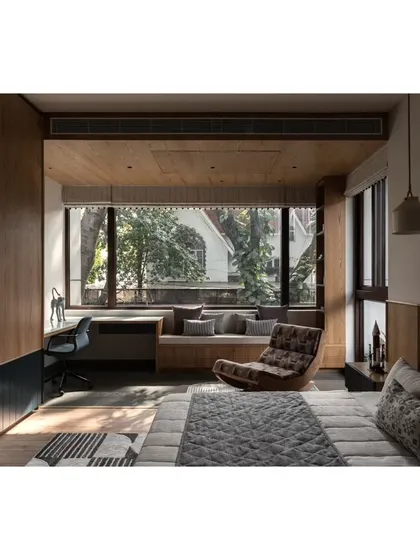 Another angle of the bedroom, showcasing the ample storage and the balance of wood tones with dark blue accents. It's a practical and stylish space for a growing child.