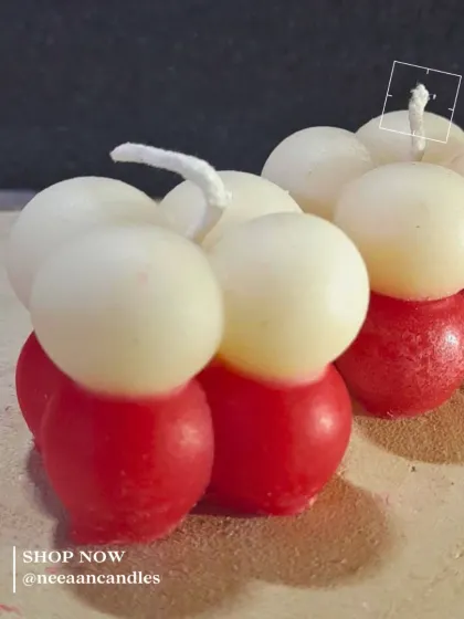 Sweet like candy, but it’s a candle. Our handcrafted red and white bubble candle brings a pop of color and charm.