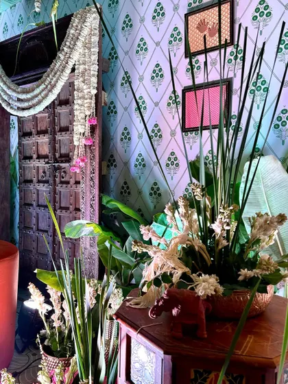 Detail shot of a corner table, featuring floral arrangements and decor pieces that complement the overall Southern Grace theme.