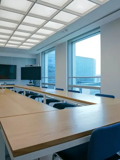 An alternate angle of the large boardroom, showing the view of the city skyline. We design meeting spaces that are not only functional but also impressive to clients and visitors.