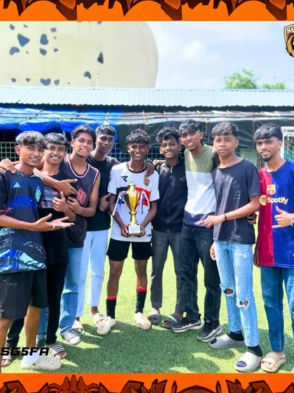 A player celebrating with his friends after a successful tournament run. These bonds of friendship are forged on and off the pitch.