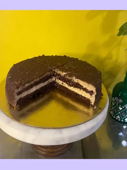 My Almond Rocher cake is a celebration of texture and flavor. It features crunchy almond layers that envelop a rich, velvety chocolate center. It’s one of my signature cakes and a true indulgence.