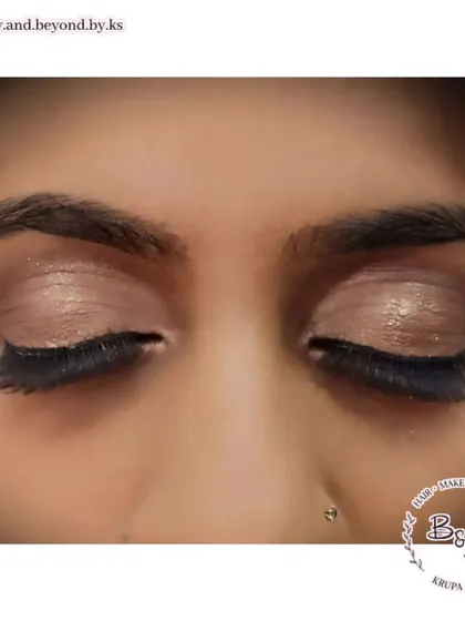 A duplicate of image 24, providing a clear view of the soft brown smokey eye makeup.