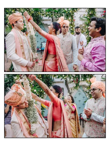 A closer look at the competitive spirit of the Jaimala ceremony. The bride triumphantly places the garland on her groom, surrounded by the smiling faces of their loved ones.