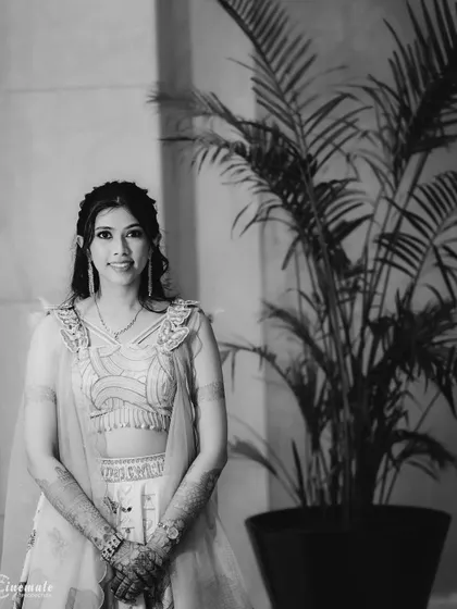 A classic black and white portrait of the bride-to-be, using natural light and simple backgrounds to create a timeless look.