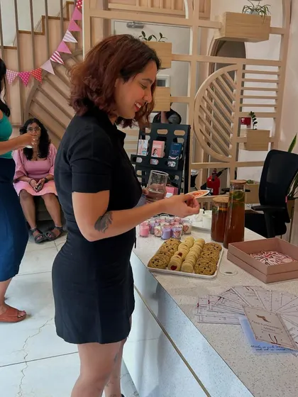 Our team member enjoying the treats at our Galentine's Day event. We believe in keeping things cute with candles, stickers, and cookies.