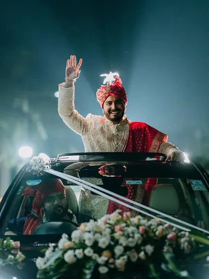 The groom makes a stylish entry, waving from a decorated convertible. I plan every entrance to be as unique and full of personality as the couple themselves.
