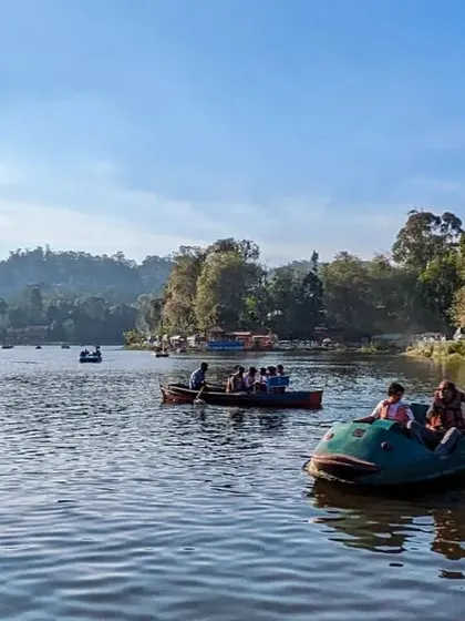 A panoramic view of the bustling Kodaikanal lake, a popular spot on our trip itinerary.