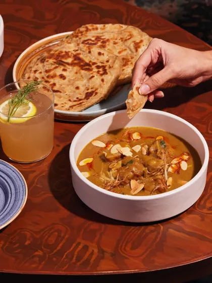 A rich, creamy chicken korma, perfect for dipping a piece of flaky paratha into. This is Mughlai-inspired comfort food at its best.