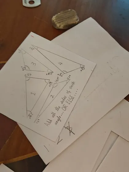 More scenes of mathematics in action, from children measuring themselves against a chalkboard to creating secret rooms of math puzzles. These images show how math is a joyful, creative, and collaborative language at our school.