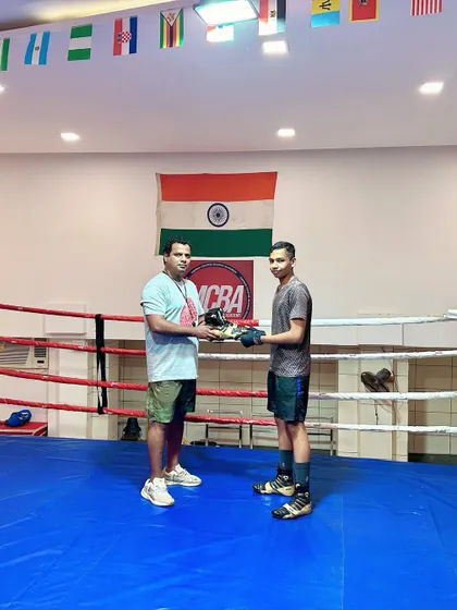 Rewarding my best-performing students with new boxing shoes. A small gesture to keep their spirits high and acknowledge their hard work.
