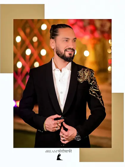 A stylish portrait of groom Sumit, his modern hairstyle and embellished blazer making a statement.