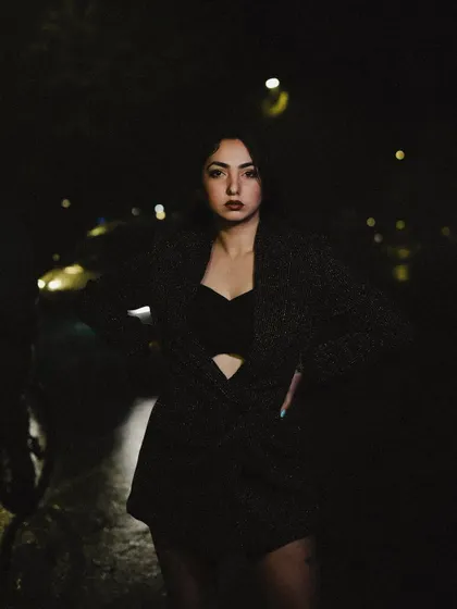A close-up portrait from the night shoot, with a direct and intense gaze.