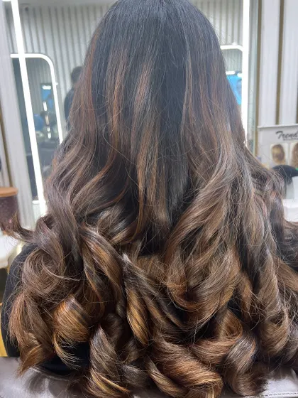 A closer look at this trendy makeover, highlighting the warm caramel and copper tones that give this style so much life.