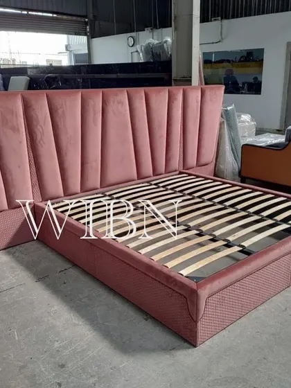 Straight from the factory and all set to go. This custom bed features a dramatic, oversized, channel-tufted headboard in a beautiful dusty pink velvet.