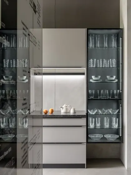 The Ahmedabad showroom, designed by Anarr Gunjaria, features this elegant display with illuminated glass cabinets, creating an environment that feels both elevated and approachable.