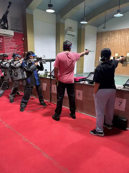 A mix of our rifle and pistol shooters training side by side, showcasing the diverse community of athletes at our club.