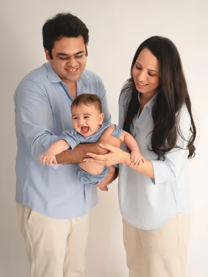 A moment of pure joy and laughter. Playing with your baby during the shoot is the best way to get these wonderfully authentic and happy expressions.