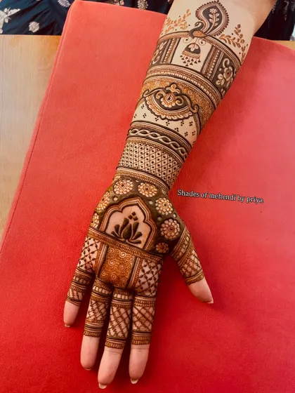 A full view of the arm for a Gudhi Padwa special design, which is also suitable for bridal occasions. It features multiple bands of different traditional patterns.